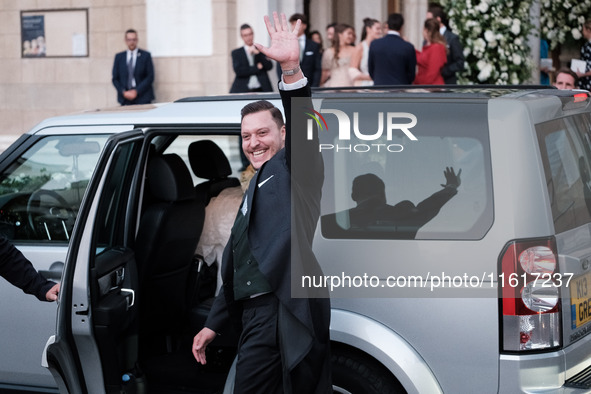 Matthew Jeremiah Kumar greets after his wedding with Princess Theodora Glucksburg at the Metropolitan Cathedral of Athens in Athens, Greece,...