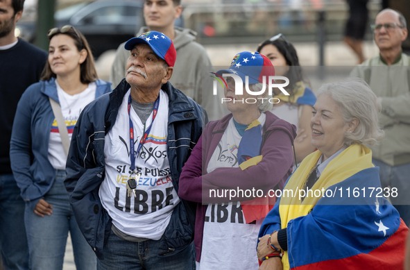 Several people wearing caps with the Venezuelan flag gather during a demonstration at Restauradores Square in Lisbon, Portugal, on September...