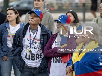 Several people wearing caps with the Venezuelan flag gather during a demonstration at Restauradores Square in Lisbon, Portugal, on September...