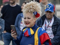 A woman wearing clothes allegorical to the Venezuelan flag gesticulates during a demonstration at Restauradores Square in Lisbon, Portugal,...