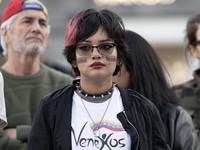 A woman with a Venezuelan flag drawn on her face rallies during a demonstration at Restauradores Square in Lisbon, Portugal, on September 28...