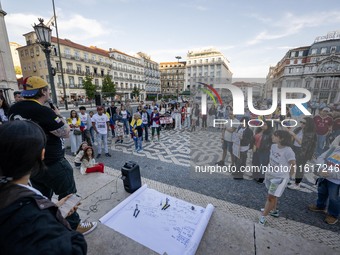 Several activists rally during a demonstration in Restauradores Square in Lisbon, Portugal, on September 28, 2024, as a result of the allege...