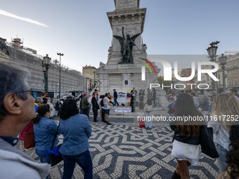 Several activists rally during a demonstration in Restauradores Square in Lisbon, Portugal, on September 28, 2024, as a result of the allege...