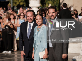 Philippos, son of former King of Greece Constantine II, and his wife Nina Flohn arrive for the wedding of Princess Theodora Glucksburg of Gr...