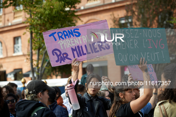 People hold signs reading 'Transparenthood by thousands' and 'let us do abortion as we want'. For International Safe Abortion Day, hundreds...