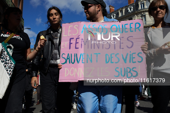 Someone holds a cardboard sign reading 'Feminist and queer associations save lives'. For International Safe Abortion Day, hundreds of women...