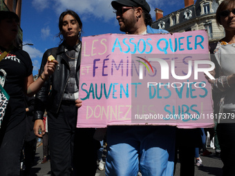 Someone holds a cardboard sign reading 'Feminist and queer associations save lives'. For International Safe Abortion Day, hundreds of women...