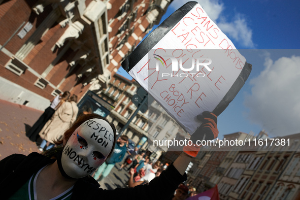 A person in the march holds a placard reading 'Without right it's needles or hanger'. For International Safe Abortion Day, hundreds of women...