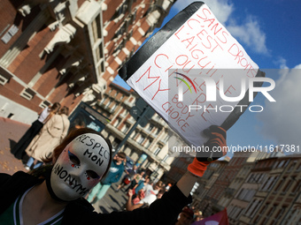 A person in the march holds a placard reading 'Without right it's needles or hanger'. For International Safe Abortion Day, hundreds of women...