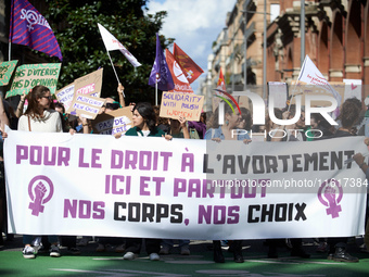 The banner reads 'For the right to abort, here and there, our bodies, our rights'. For International Safe Abortion Day, hundreds of women an...