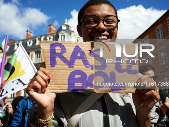 A woman holds a placard reading 'Fed up'. For International Safe Abortion Day, hundreds of women and men take to the streets in Toulouse, Fr...