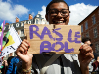 A woman holds a placard reading 'Fed up'. For International Safe Abortion Day, hundreds of women and men take to the streets in Toulouse, Fr...