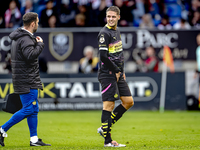 PSV Eindhoven midfielder Joey Veerman gets injured during the match between Willem II and PSV at the Koning Willem II stadium for the Dutch...