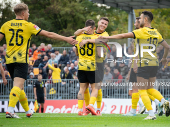 Wieczysta players celebrate scoring a goal during the game between Wieczysta Krakow and Skra Czestochowa in Krakow, Poland, on September 28,...