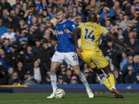 Jarrad Branthwaite #32 of Everton F.C. is tackled by Jean-Philippe Mateta #14 of Crystal Palace F.C. during the Premier League match between...