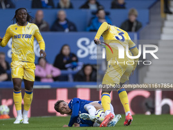 Tyrick Mitchell #3 of Crystal Palace F.C. fouls the opponent during the Premier League match between Everton and Crystal Palace at Goodison...