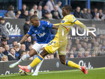 Ashley Young #18 of Everton F.C. is tackled by Tyrick Mitchell #3 of Crystal Palace F.C. during the Premier League match between Everton and...