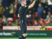 Referee Declan Bourne gives the thumbs up to his assistant during the Sky Bet League 1 match between Barnsley and Stockport County at Oakwel...