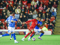 #2, Barry Cotter of Barnsley, tries to get past #3, Ibou Touray of Stockport during the Sky Bet League 1 match between Barnsley and Stockpor...