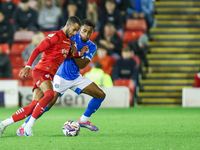 #2, Barry Cotter of Barnsley, tries to get past #3, Ibou Touray of Stockport during the Sky Bet League 1 match between Barnsley and Stockpor...