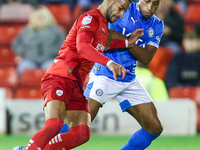 #2, Barry Cotter of Barnsley, tries to get past #3, Ibou Touray of Stockport during the Sky Bet League 1 match between Barnsley and Stockpor...