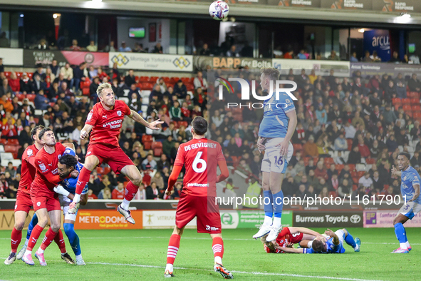 Marc Roberts of Barnsley gets up to head the ball clear during the Sky Bet League 1 match between Barnsley and Stockport County at Oakwell i...