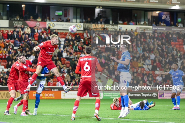 Marc Roberts of Barnsley gets up to head the ball clear during the Sky Bet League 1 match between Barnsley and Stockport County at Oakwell i...