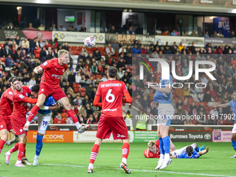 Marc Roberts of Barnsley gets up to head the ball clear during the Sky Bet League 1 match between Barnsley and Stockport County at Oakwell i...