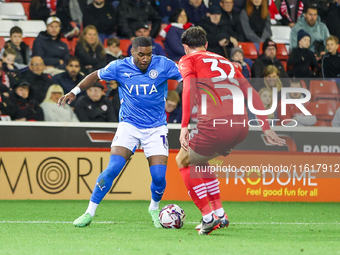 #10, Jayden Fevrier of Stockport tries to get past #32, Josh Earl of Barnsley during the Sky Bet League 1 match between Barnsley and Stockpo...