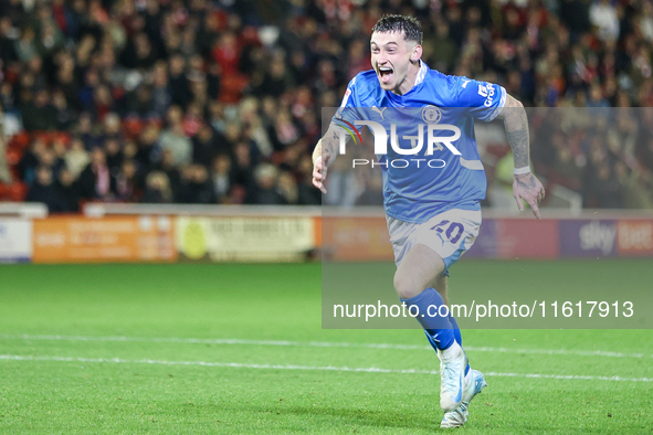 Louie Barry of Stockport races to celebrate his injury-time equalizer during the Sky Bet League 1 match between Barnsley and Stockport Count...