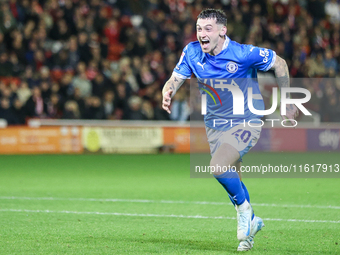 Louie Barry of Stockport races to celebrate his injury-time equalizer during the Sky Bet League 1 match between Barnsley and Stockport Count...