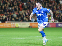 Louie Barry of Stockport races to celebrate his injury-time equalizer during the Sky Bet League 1 match between Barnsley and Stockport Count...