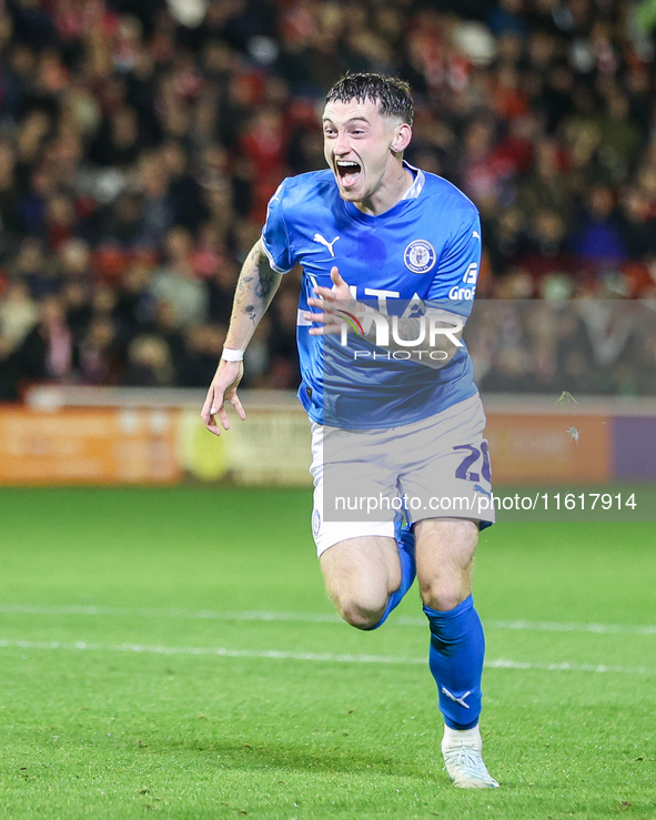 Louie Barry of Stockport races to celebrate his injury-time equalizer during the Sky Bet League 1 match between Barnsley and Stockport Count...