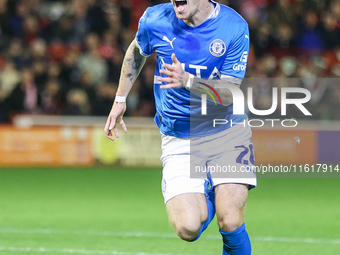 Louie Barry of Stockport races to celebrate his injury-time equalizer during the Sky Bet League 1 match between Barnsley and Stockport Count...