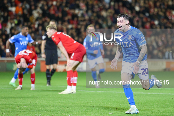 Louie Barry of Stockport races to celebrate his injury-time equalizer during the Sky Bet League 1 match between Barnsley and Stockport Count...