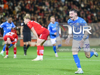 Louie Barry of Stockport races to celebrate his injury-time equalizer during the Sky Bet League 1 match between Barnsley and Stockport Count...