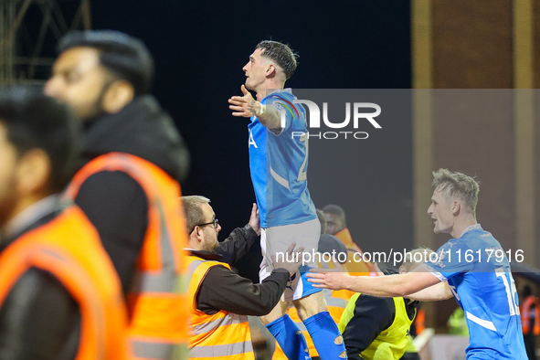 #20, Louie Barry of Stockport (center) celebrates in front of the traveling fans during the Sky Bet League 1 match between Barnsley and Stoc...