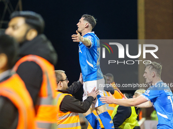 #20, Louie Barry of Stockport (center) celebrates in front of the traveling fans during the Sky Bet League 1 match between Barnsley and Stoc...