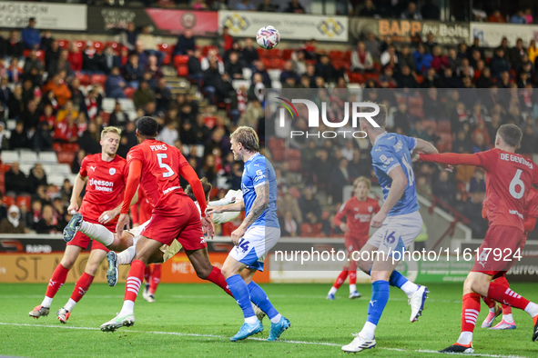 Gabriel Slonina punches the ball away during the Sky Bet League 1 match between Barnsley and Stockport County at Oakwell in Barnsley, Englan...