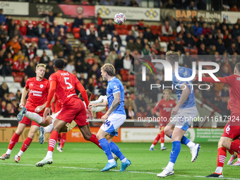 Gabriel Slonina punches the ball away during the Sky Bet League 1 match between Barnsley and Stockport County at Oakwell in Barnsley, Englan...