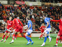 Gabriel Slonina punches the ball away during the Sky Bet League 1 match between Barnsley and Stockport County at Oakwell in Barnsley, Englan...