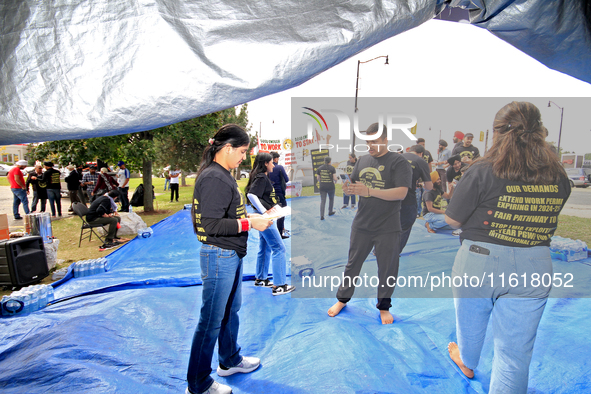 Participants set up for a protest at an international students' encampment in Brampton, Canada, on September 28, 2024. The encampment is in...