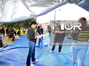 Participants set up for a protest at an international students' encampment in Brampton, Canada, on September 28, 2024. The encampment is in...