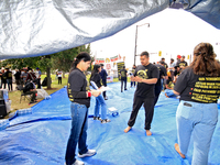 Participants set up for a protest at an international students' encampment in Brampton, Canada, on September 28, 2024. The encampment is in...