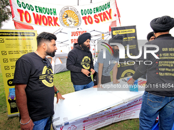 Organizers set up for a protest at an international students' encampment in Brampton, Canada, on September 28, 2024. The encampment is in it...