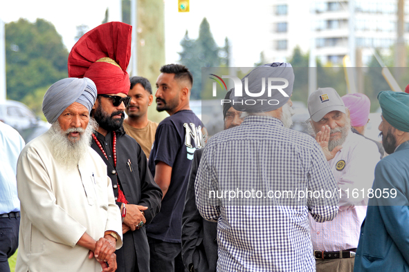 Community members gather ahead of a protest at an international students' encampment in Brampton, Canada, on September 28, 2024. The encampm...