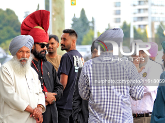 Community members gather ahead of a protest at an international students' encampment in Brampton, Canada, on September 28, 2024. The encampm...