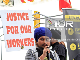 Organizer Amar Deep Singh speaks during a protest rally at an international students' encampment in Brampton, Canada, on September 28, 2024....