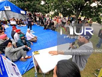 Organizer Amar Deep Singh speaks during a protest rally at an international students' encampment in Brampton, Canada, on September 28, 2024....