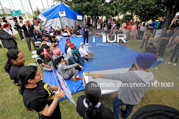 Organizer Amar Deep Singh speaks during a protest rally at an international students' encampment in Brampton, Canada, on September 28, 2024....